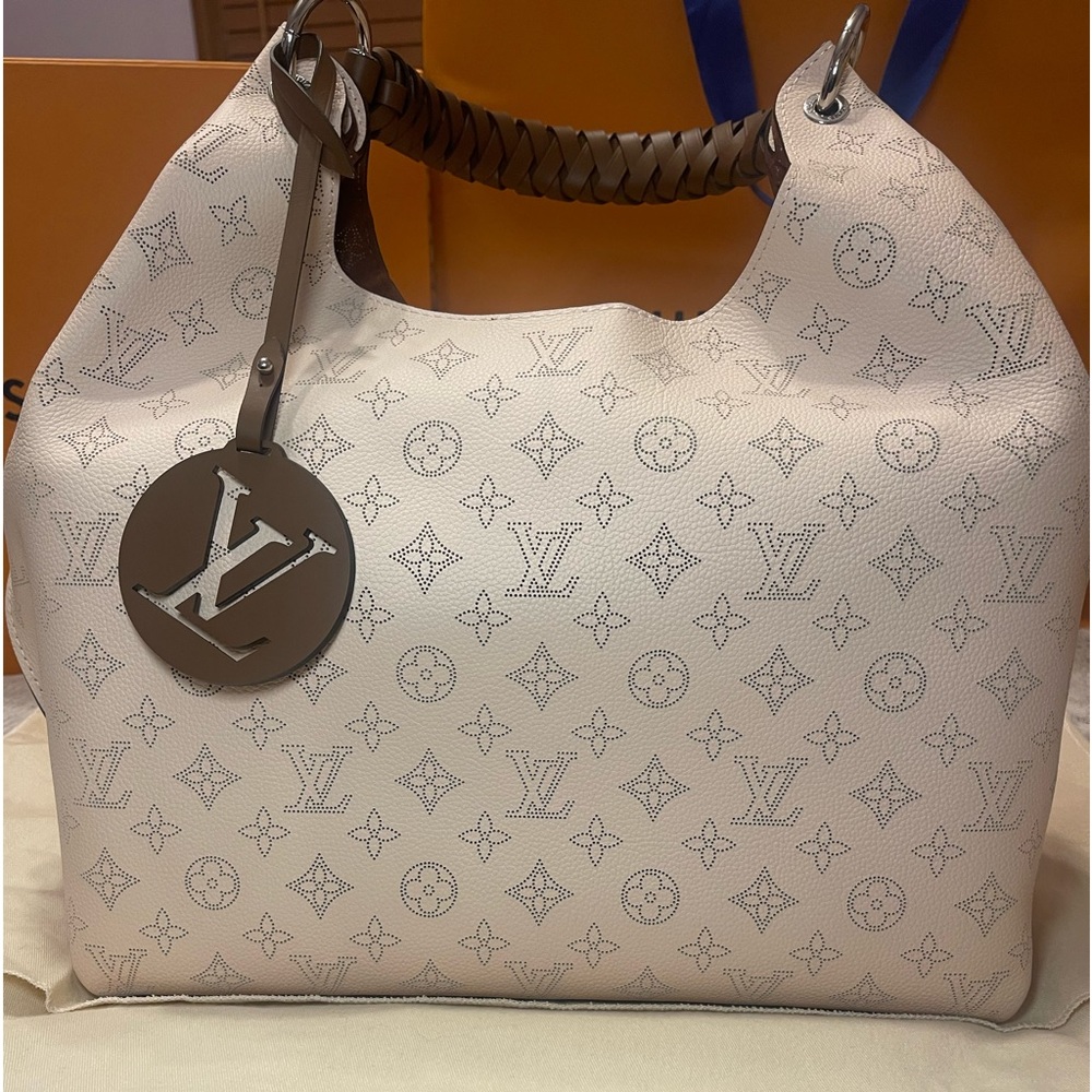 Louis Vuitton Carmel hobo bag is spacious, lightweight in Mahina calf leather.